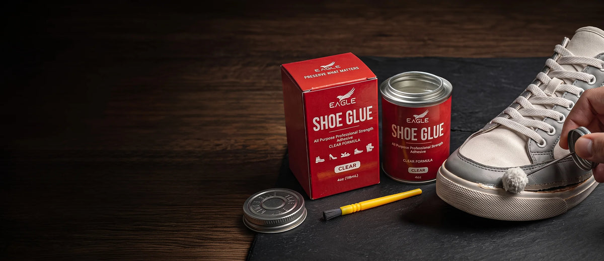 Eagle Shoe Glue box and can with an applicator brush beside a sneaker